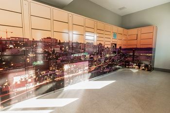 A rendering of a cityscape on a wall in a room